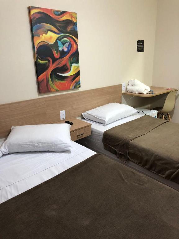Cama ou camas em um quarto em Pousada HD