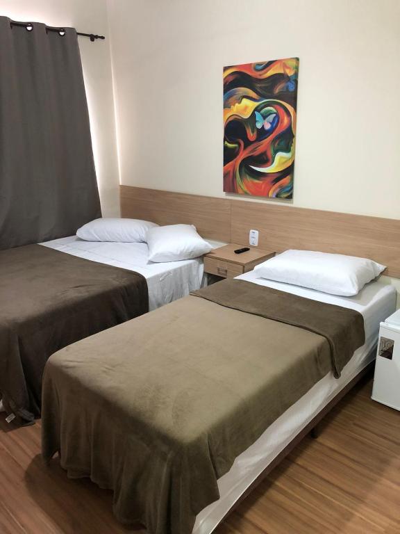 Cama ou camas em um quarto em Pousada HD