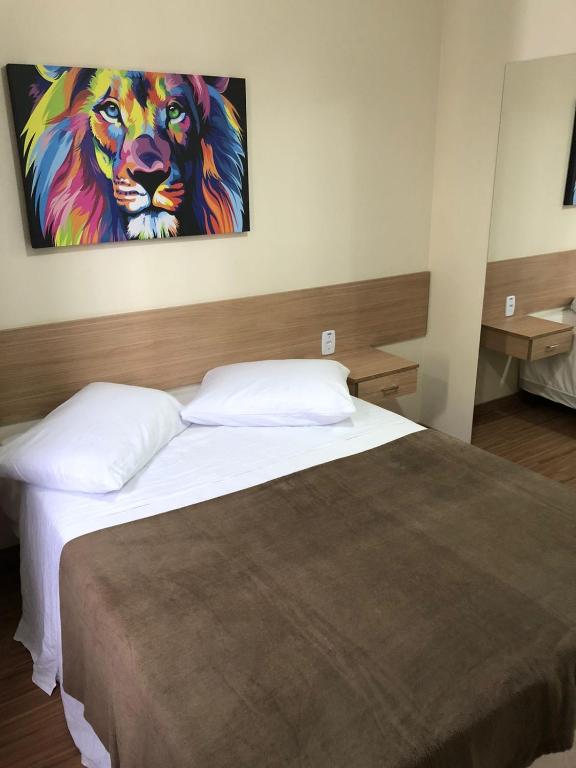 Cama ou camas em um quarto em Pousada HD