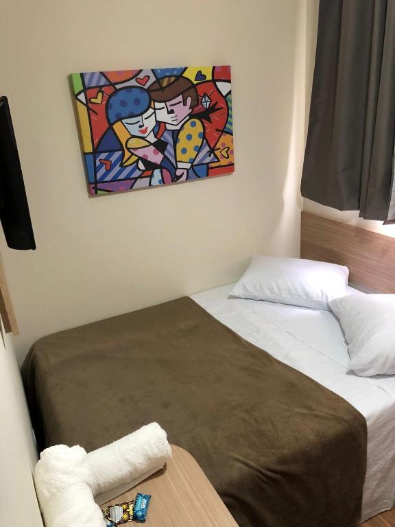 Cama ou camas em um quarto em Pousada HD