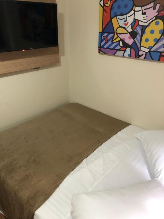 Cama ou camas em um quarto em Pousada HD