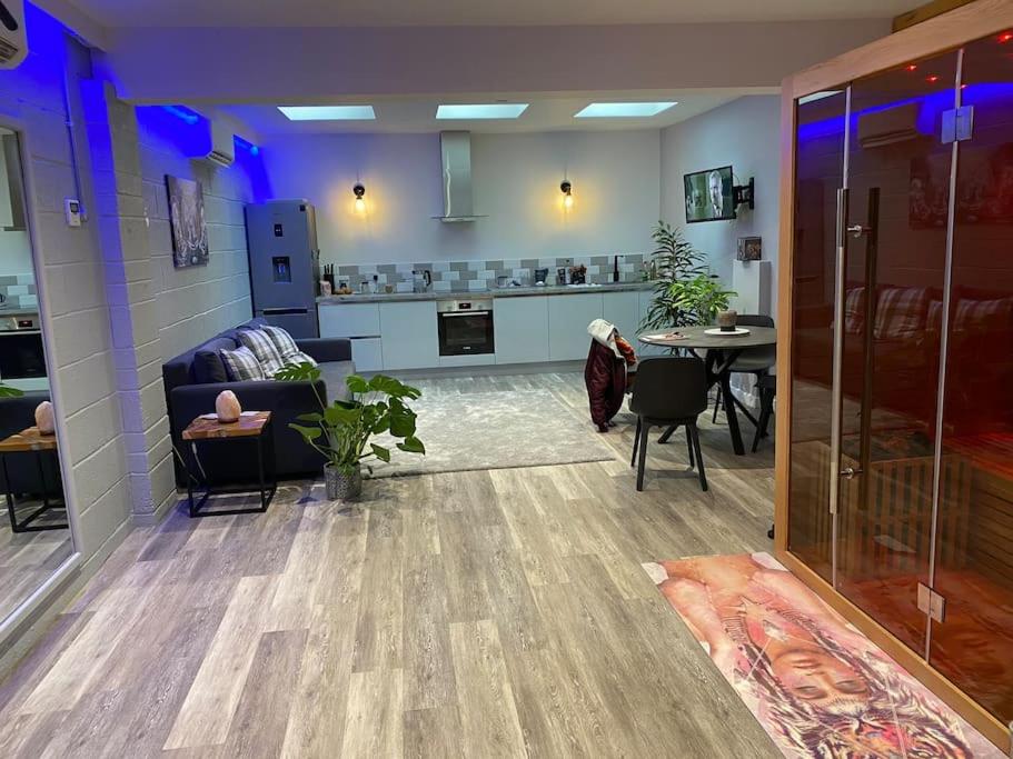 a living room with a couch and a table at Terry’s yard, southville, Bristol in Bristol