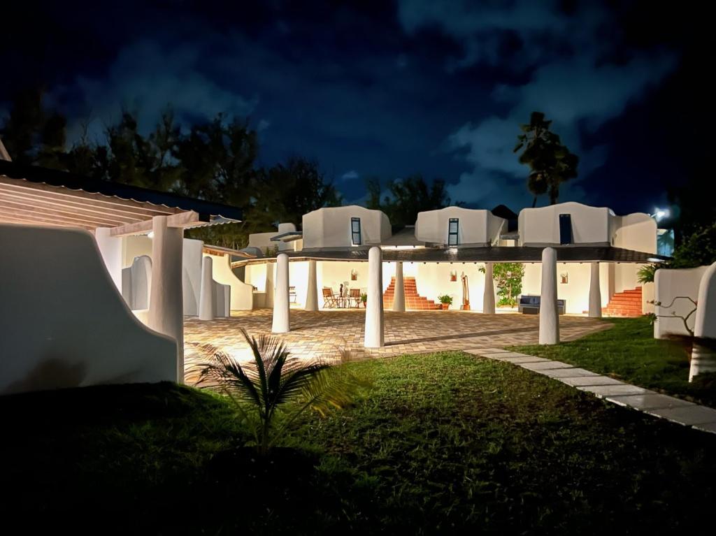 a view of a house at night at OceanBlue Resort in Christ Church