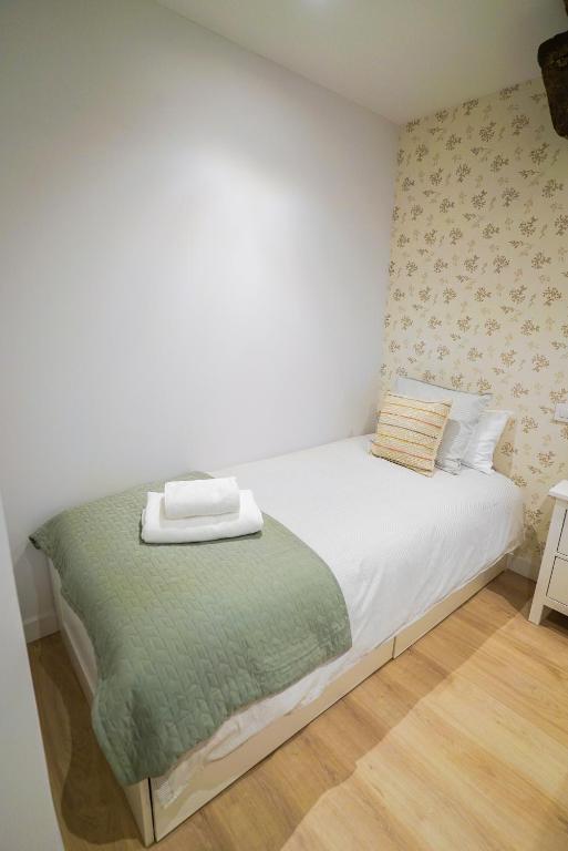 Łóżko lub łóżka w pokoju w obiekcie Homely Rooms