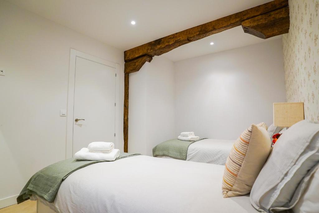 Łóżko lub łóżka w pokoju w obiekcie Homely Rooms