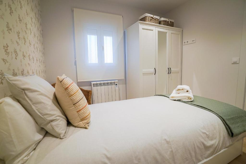 Łóżko lub łóżka w pokoju w obiekcie Homely Rooms