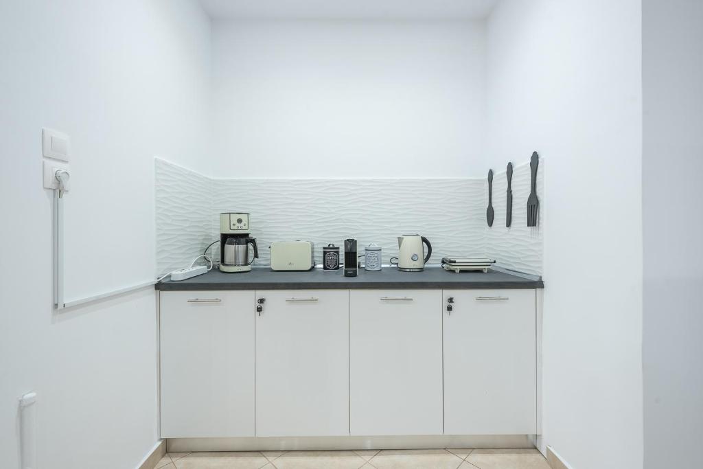 A kitchen or kitchenette at ATHENIAN HOME Near Acropolis