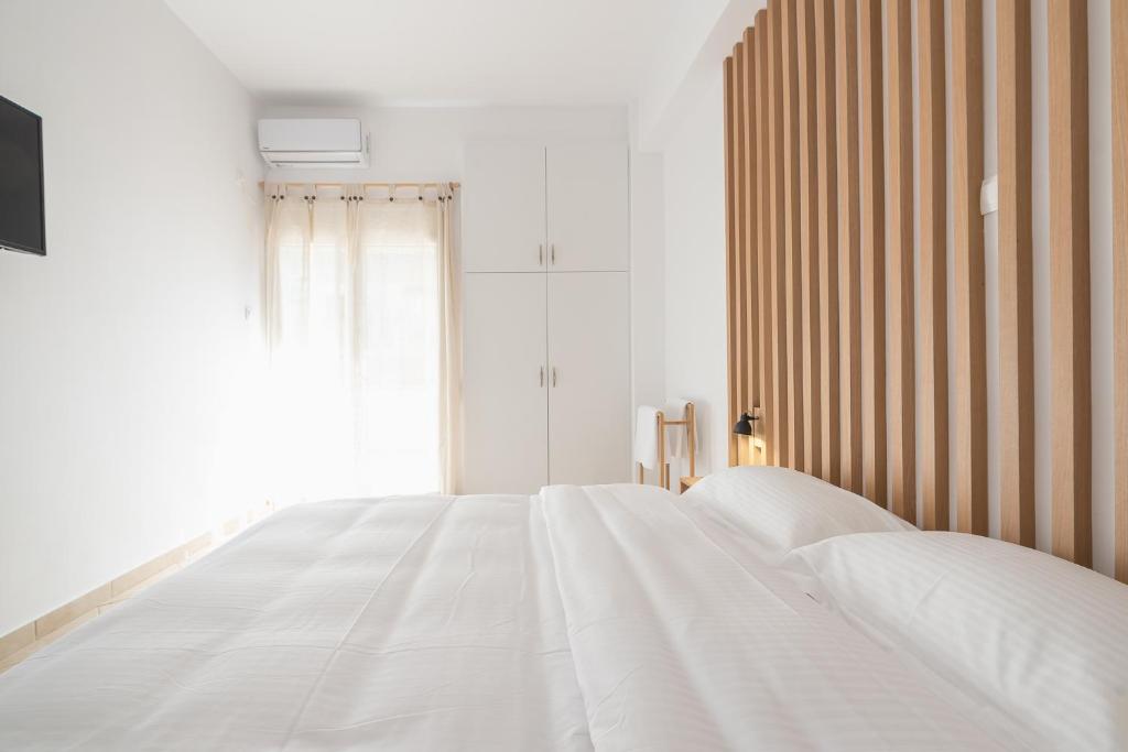A bed or beds in a room at ATHENIAN HOME Near Acropolis