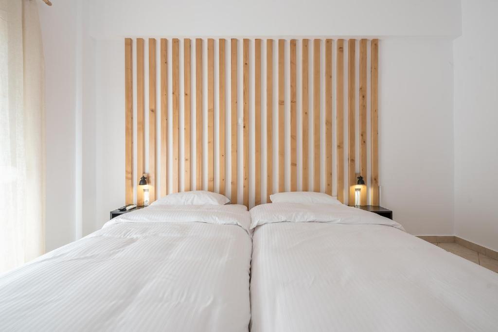 A bed or beds in a room at ATHENIAN HOME Near Acropolis