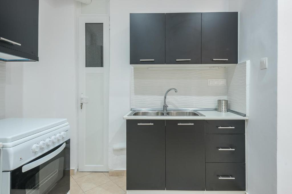 A kitchen or kitchenette at ATHENIAN HOME Near Acropolis
