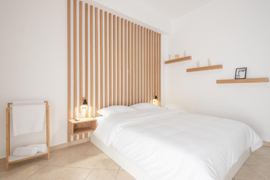 A bed or beds in a room at ATHENIAN HOME Near Acropolis