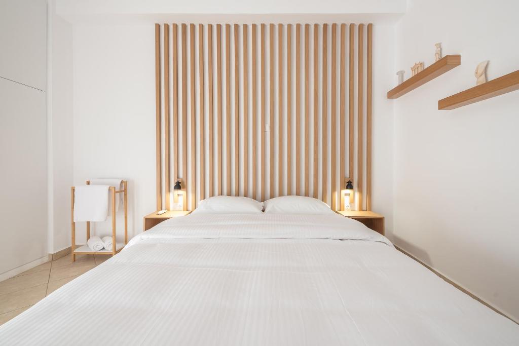 A bed or beds in a room at ATHENIAN HOME Near Acropolis