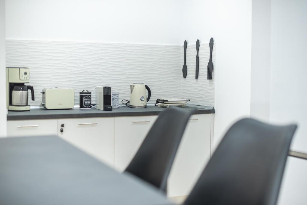 A kitchen or kitchenette at ATHENIAN HOME Near Acropolis