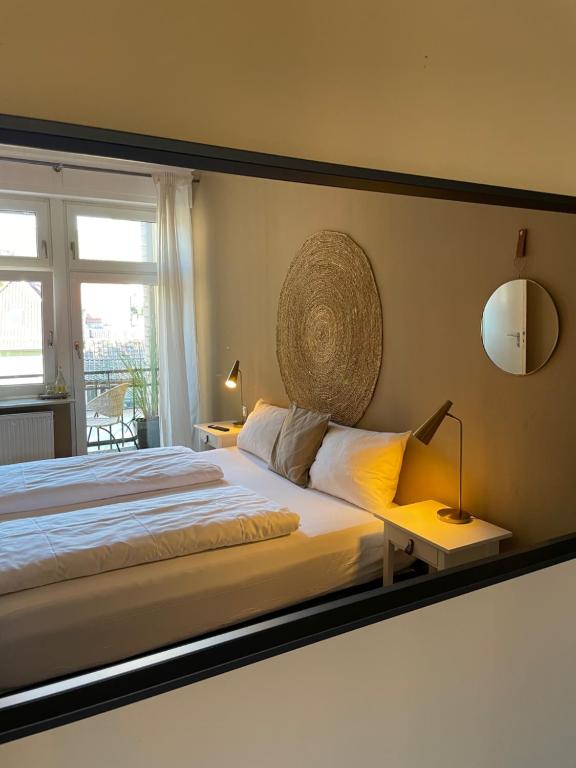 Postel nebo postele na pokoji v ubytování AUERSTEIN-Hotels auerstein & auerstein-mono