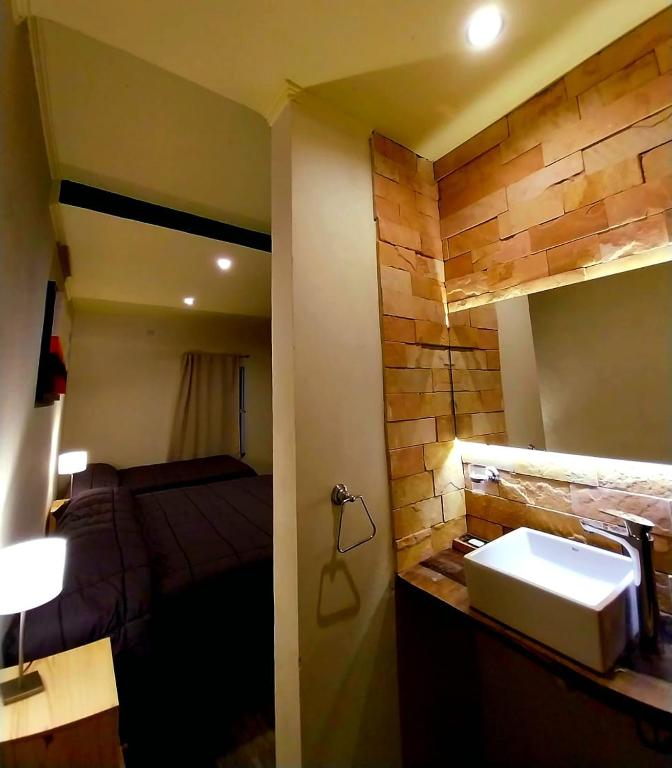 Uma cama ou camas num quarto em Hostería Jasy