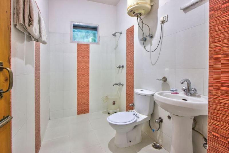Koupelna v ubytování Ayushman Hotels