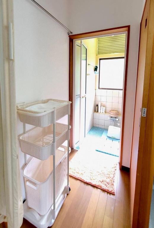 Postel nebo postele na pokoji v ubytování Iruma INN