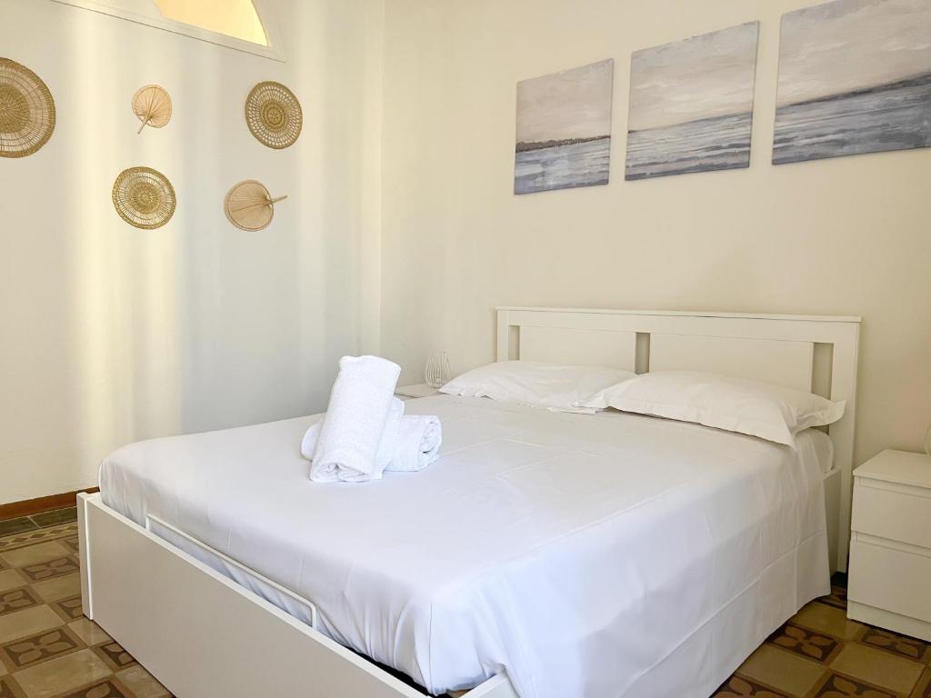 Łóżko lub łóżka w pokoju w obiekcie Civico 41 Lucca City Center Apartment