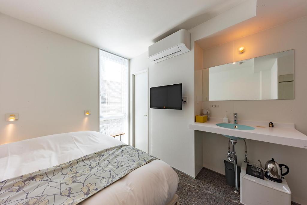 Postel nebo postele na pokoji v ubytování plat hostel keikyu kamakura wave