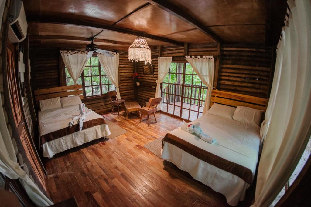 Postel nebo postele na pokoji v ubytování Hotel El Chital