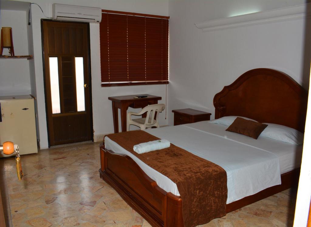Postel nebo postele na pokoji v ubytování Hotel Tayrona