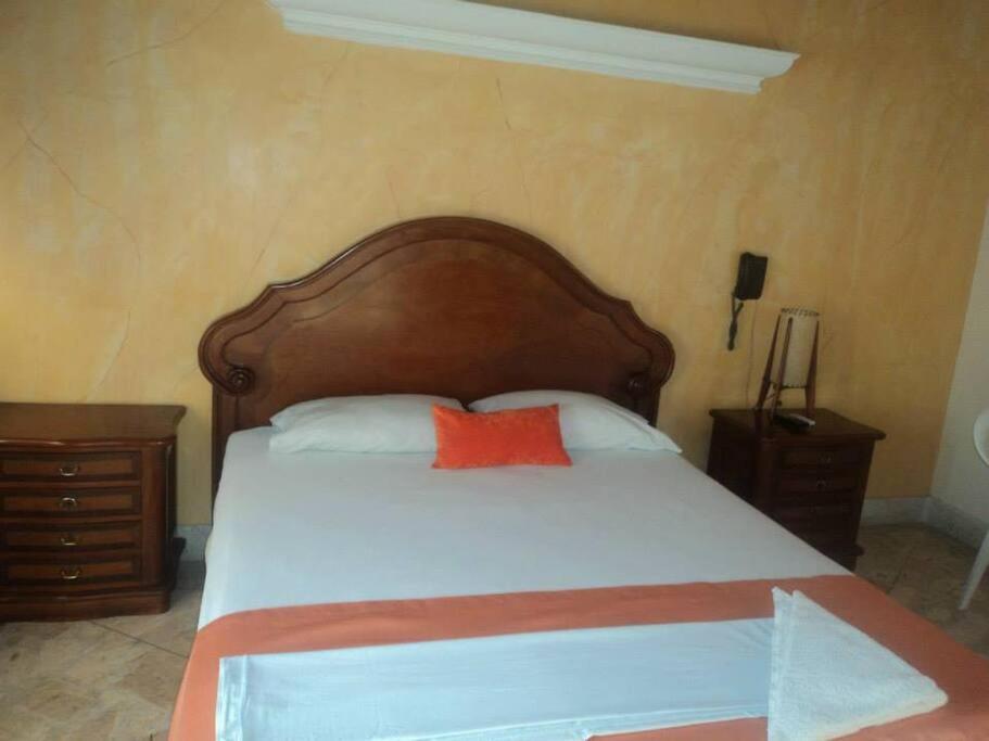 Postel nebo postele na pokoji v ubytování Hotel Tayrona