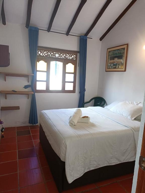 Postel nebo postele na pokoji v ubytování Hostal Home Sant Angelo