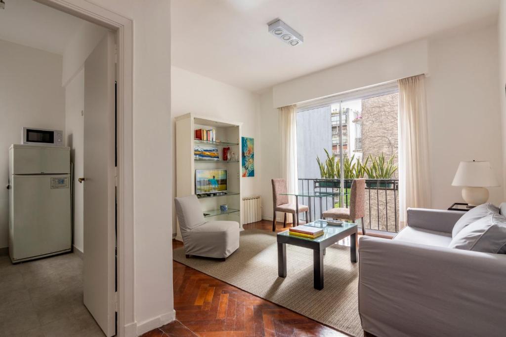 a living room with a couch and a table at Recoleta in Buenos Aires