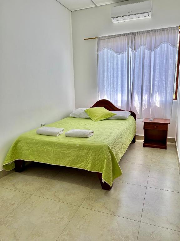Postel nebo postele na pokoji v ubytování Hostal Punta Arena