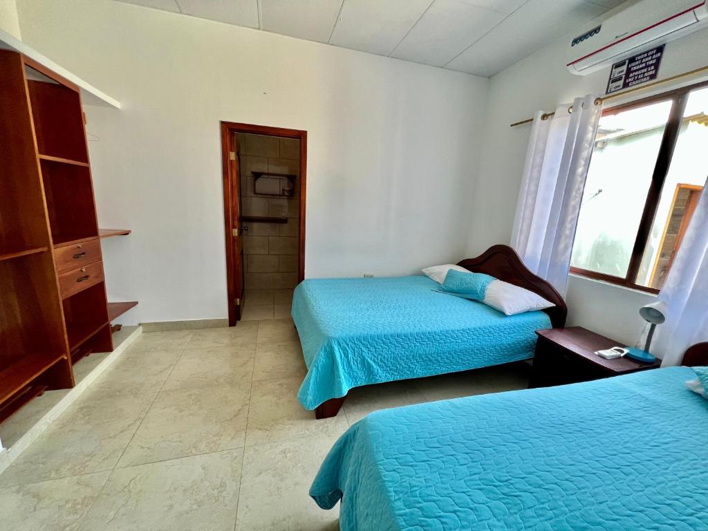 Postel nebo postele na pokoji v ubytování Hostal Punta Arena