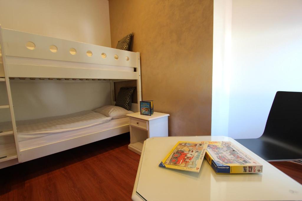 Postel nebo postele na pokoji v ubytování Toni's Alpine Loft & SPA