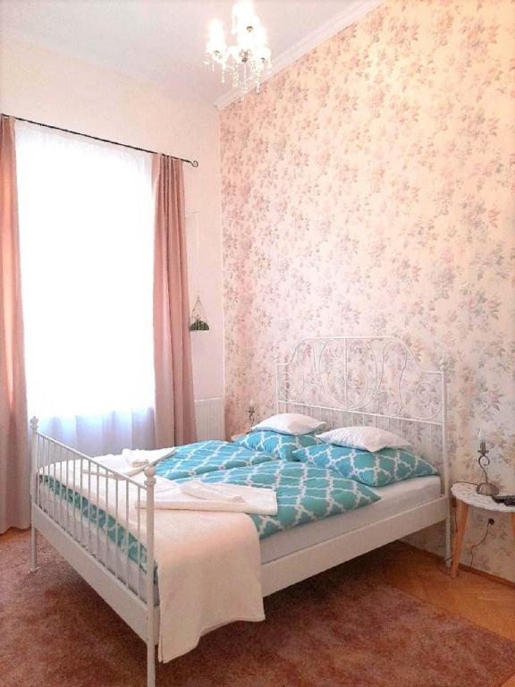 Posteľ alebo postele v izbe v ubytovaní D16 Apartman