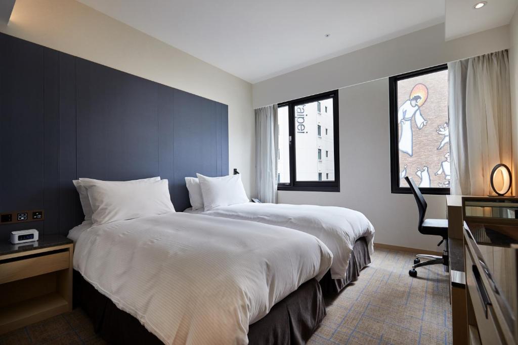 Postel nebo postele na pokoji v ubytování K Hotels Taipei Linsen