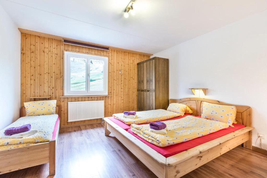 Postel nebo postele na pokoji v ubytování Heuberge