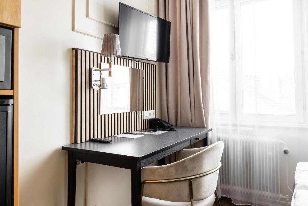 TV a/nebo společenská místnost v ubytování Comfort Hotel Linköping City
