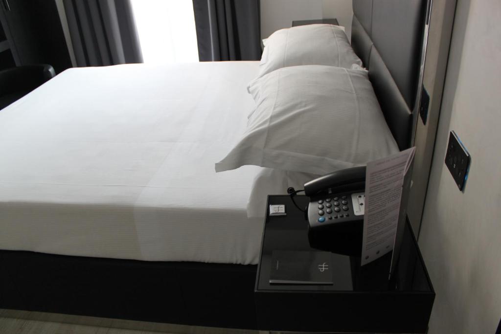 Postel nebo postele na pokoji v ubytování LHP Hotel Napoleon