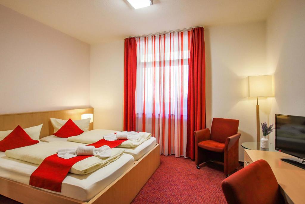 Postel nebo postele na pokoji v ubytování Panorama Hotel Winterberg