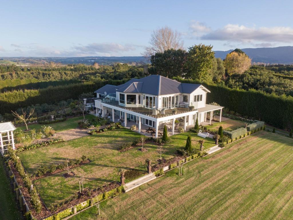 an aerial view of a large white house at RIDGETON in Aongatete