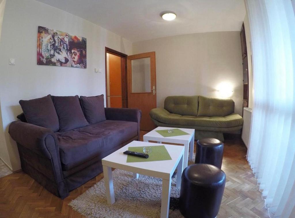 a living room with a couch and a table at Marija in Zlatibor