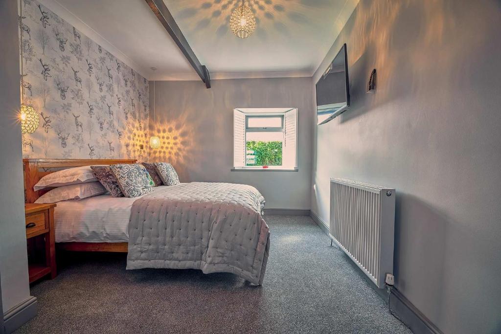 Postel nebo postele na pokoji v ubytování Host & Stay - Bluebell Cottage