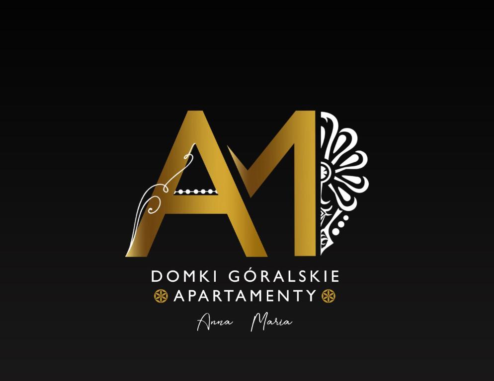 a and ma gold logo with a knife at Domki Góralskie Anna Maria in Chochołów