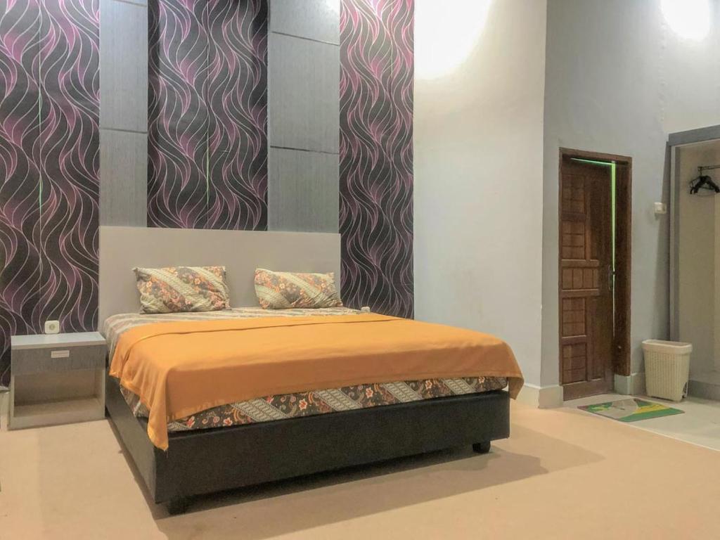 Katil atau katil-katil dalam bilik di Edotel SMKN 2 Pinrang Mitra RedDoorz
