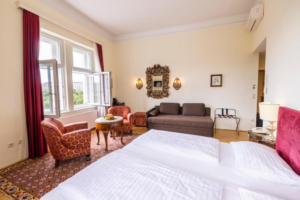 Łóżko lub łóżka w pokoju w obiekcie Hotel Regina