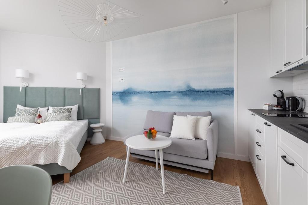Łóżko lub łóżka w pokoju w obiekcie Apartments Mazowiecka Pobierowo by Noclegi Renters
