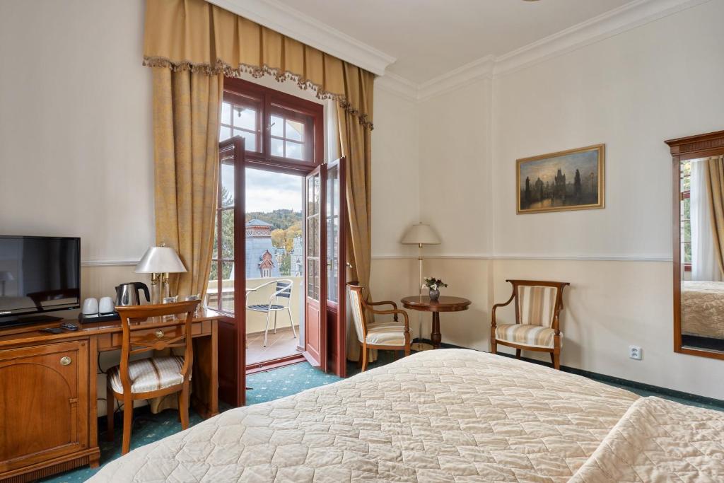 Postel nebo postele na pokoji v ubytování Spa Hotel Villa Ritter