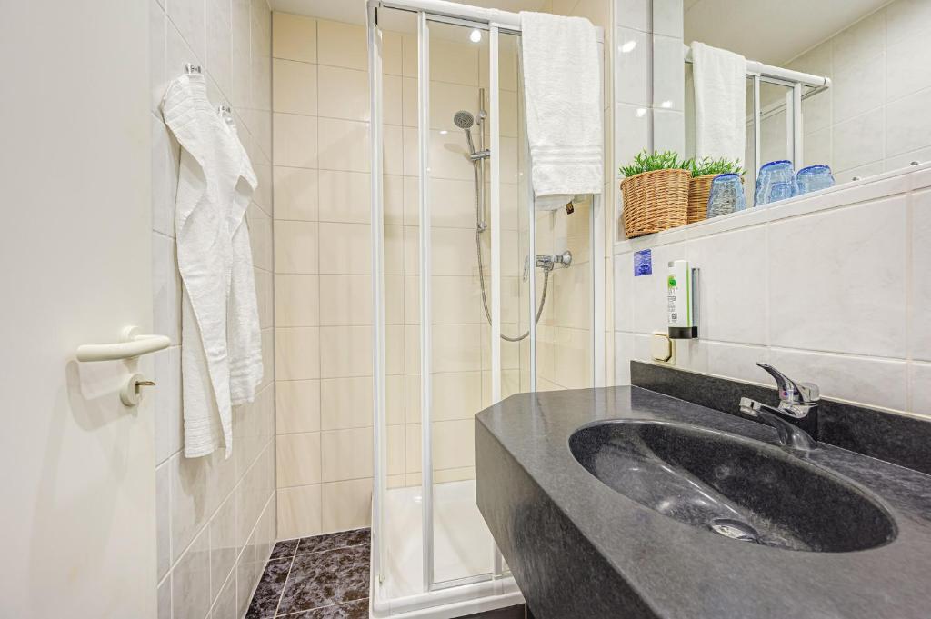 Vannituba majutusasutuses Hotel Mühlhäuser Hof