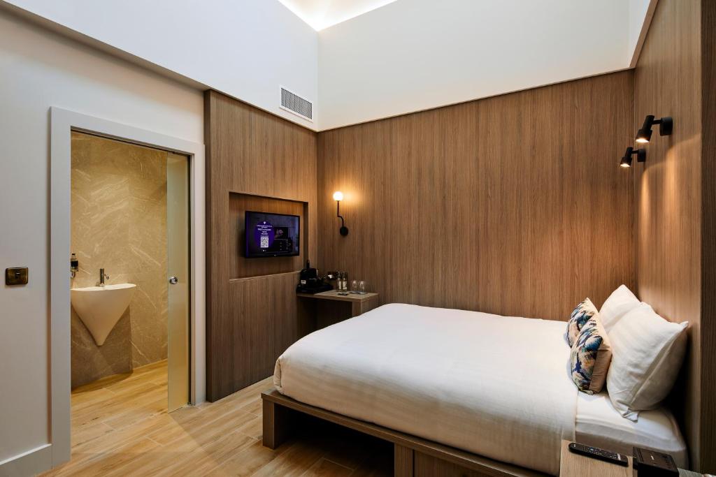 Postel nebo postele na pokoji v ubytování Handel's Hotel