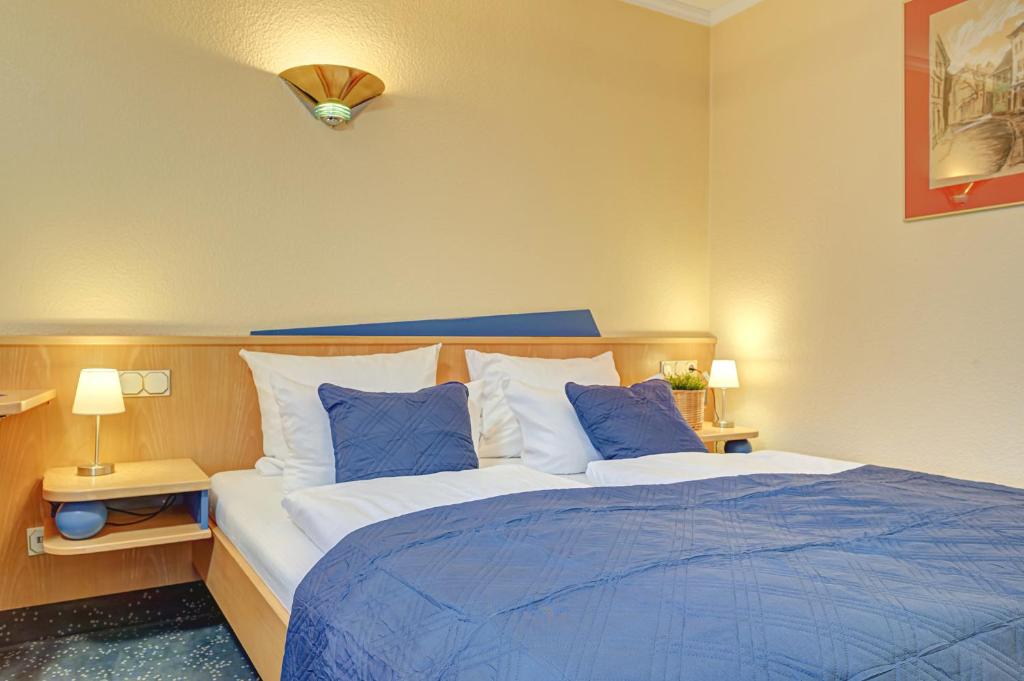 Voodi või voodid majutusasutuse Hotel Mühlhäuser Hof toas