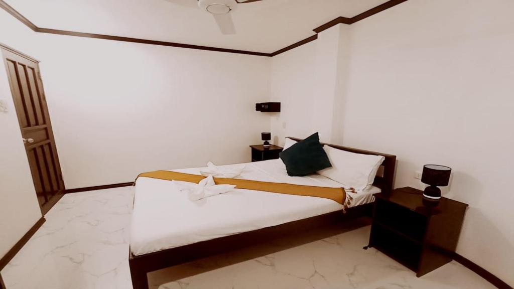 Postel nebo postele na pokoji v ubytování Hotel Oasis Port Barton