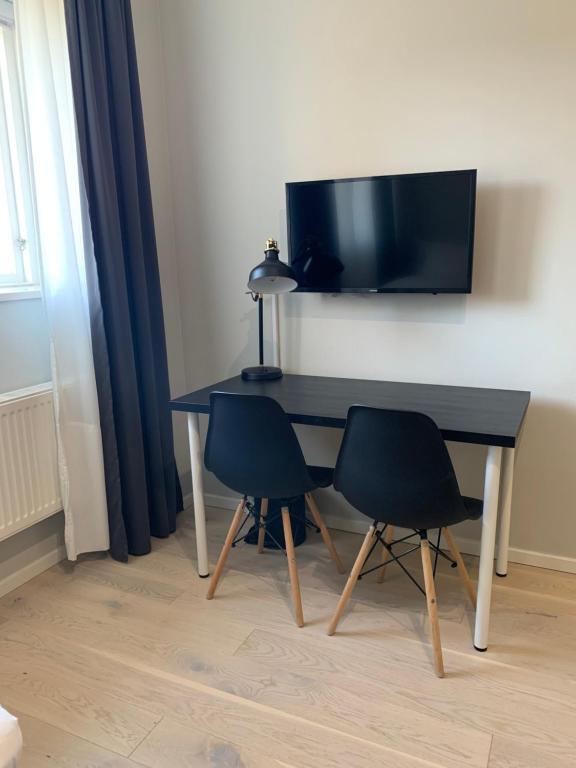 TV a/nebo společenská místnost v ubytování Foundry Hotel Apartments